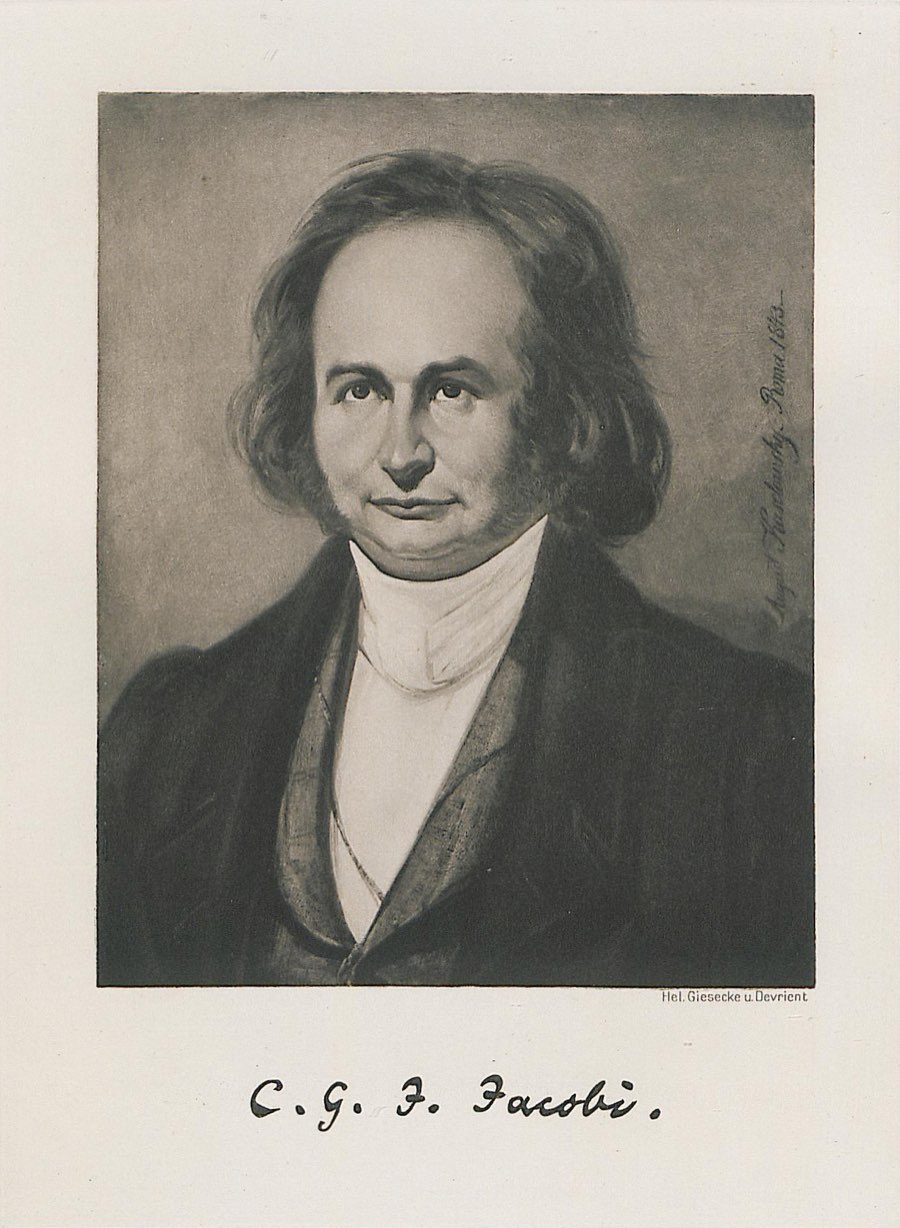 Sepia portrait of a man with wavy shoulder-length hair in a dark coat and white high collar, with a signature printed below