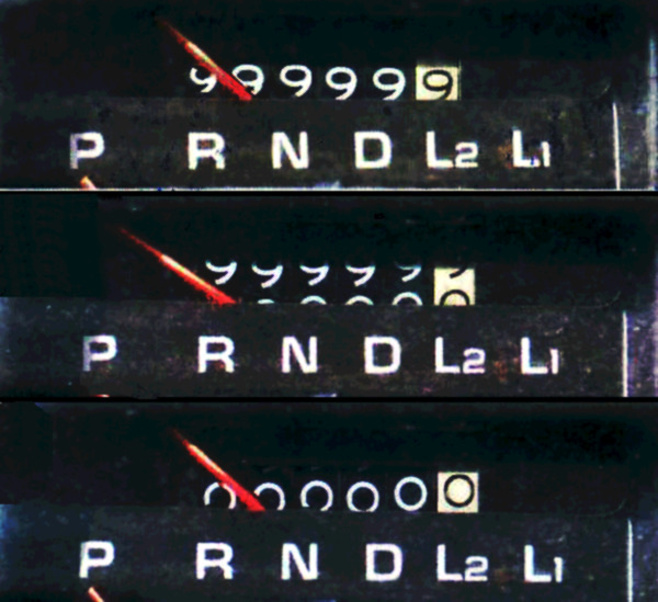 A car odometer reading 00000.0 after rolling over from 99,999.9 miles