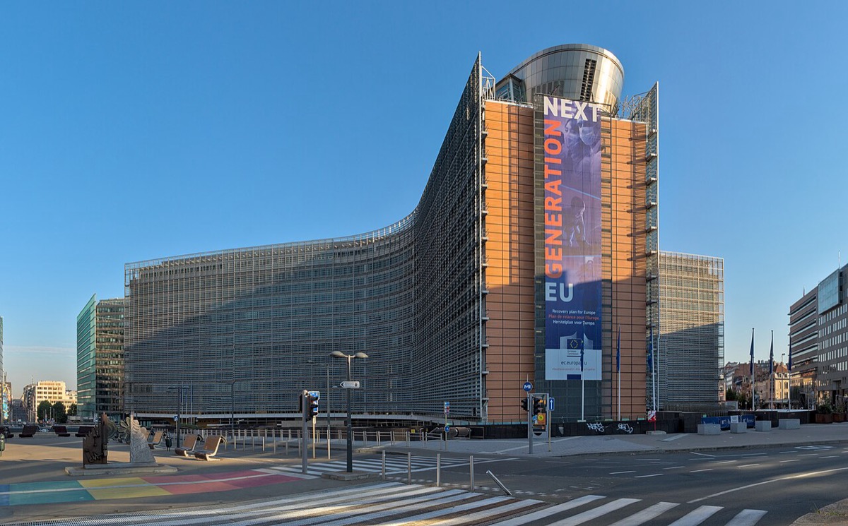 The Berlaymont building in Brussels, headquarters of the European Commission: a large cross-shaped glass building seen at an angle on a clear morning
