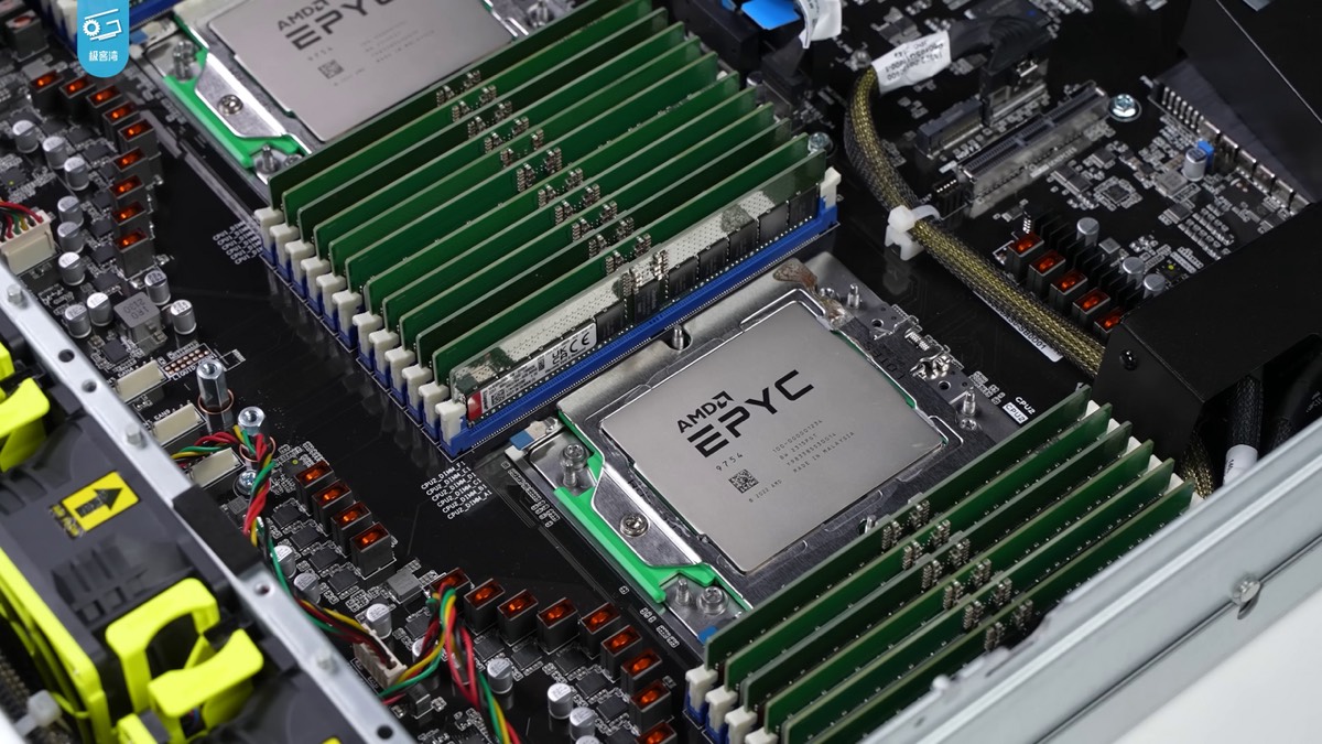 Inside a server: two large AMD EPYC processors surrounded by rows of green memory modules