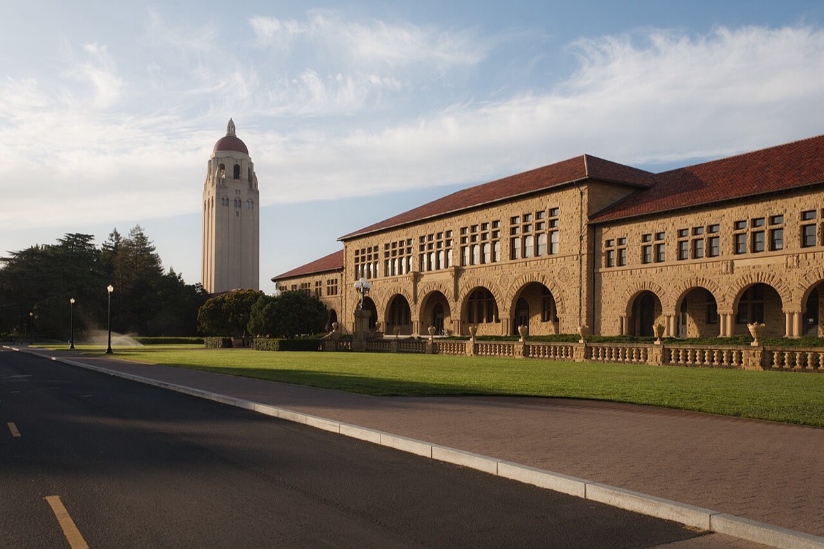 Hoover Tower and the sandstone buildings of Stanford University's main quad in evening light
