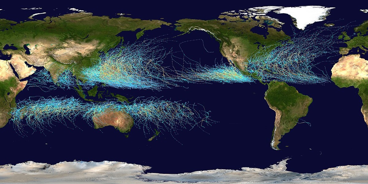 World map with thousands of colored dotted lines tracing storm paths across the tropical Pacific, Atlantic and Indian oceans