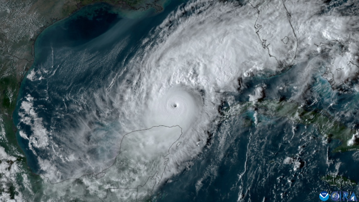 Satellite view of Hurricane Milton with a small clear eye over the Gulf of Mexico, north of the Yucatán Peninsula, with Florida to the upper right